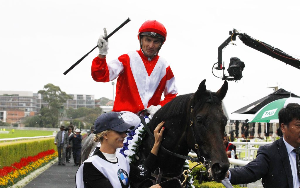 Jockey Opie Bosson gestures to the photographers after winning the BMW Australian derby on Mongolian Khan during day 1 of The Championships at Randwick racecourse in Sydney, Monday, April 6, 2015 (AAP Image/David Moir) NO ARCHIVING Jockey Opie Bosson gestures to the photographers after winning the BMW Australian derby on Mongolian Khan during day 1 of The Championships at Randwick racecourse in Sydney, Monday, April 6, 2015 (AAP Image/David Moir) NO ARCHIVING